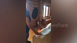 Masseuse lights towel draped over customer on FIRE and beats drum in bizarre spa session