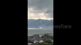 Large waterspout spirals over lake in China