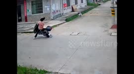 Scooter rider tripped up by power line that was tore down by overloaded truck in China