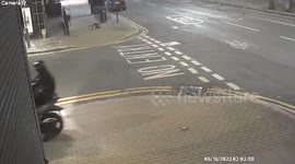 Moment two masked burglars raid London tech shop - by using power tools to cut through shutters