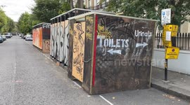 Terrible standard of plywood public toilets, wheelie bins and open urinals for the Notting Hill Carnival in London