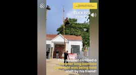 Acrobat climbs up a 6-meter long stick held up by a friend