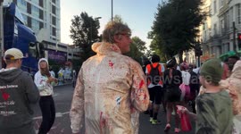 Early rising Notting Hill Carnival revellers spray each other in paints and powders at opening J'Ouvert event 2023