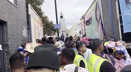 Risky Notting Hill Carnival revellers dance on top of bridge in Ladbroke Grove