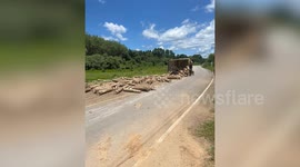 Out-of-control truck speeds past house teetering on its side before crashing