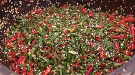 Watch Thailand's spiciest salad being made... with thousands of chillis mixed with tomatoes