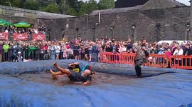 Hundreds of revellers are watching ‘world gravy wrestling championships'