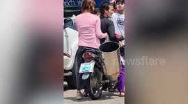 Motorcycle rider stuns road users with HUGE modified exhaust pipe