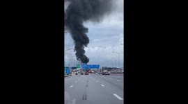 Thick black smoke rises into the air from vehicle fire on Thai motorway