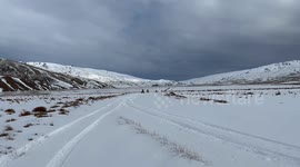 Crashing a race quad bike while drifting in snow, New Zealand