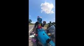 Motorcyclists Share Gummy Worms
