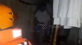 Coast guards rescue family with baby as Super Typhoon Saola floods homes in the Philippines