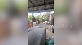 Monsoon storm blows down tree branches in Thailand