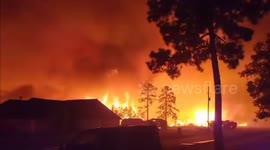Raging wildfires in Louisiana threaten to burn homes as firefighters battle blaze