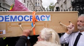 Indepdendent candidate for Uxbridge and South Ruislip Kingsley Hamilton parades a coffin at Downing Street and around Parliament Square during anti-ULEZ protest