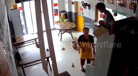 Boy's astonishing drop through ceiling lands him atop a fridge in China