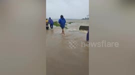 Highway turns into sea as Super Typhoon Saola dumps heavy rain on the Philippines