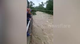 Super Typhoon Saola rescuers zipline over raging floods to save stranded children