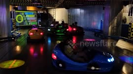 People Plat Bumper Cars at the Sega Metropark in Shanghai, China