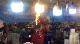 Hot stuff! Food stand makes incredible fire tea twirled through the air