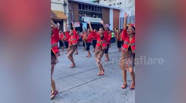 Dancers in tribal wear parade on streets for thanksgiving festival in the Philippines