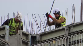 Clarendon Road Building Site construction Workmen high up on roof with concrete and steel