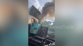 Clouds of thick grey smoke belch from lorry in Thailand