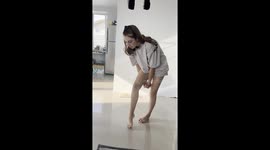 Woman Struggles to Step Through Arms