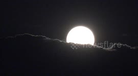 Blue supermoon rises over River Thames