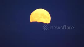 Blue supermoon seen in all its glory as it rises above Peak District in UK