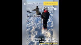 Boy catches fish the same size as him