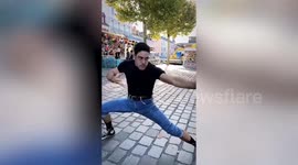 Tourist straight-punches arcade boxing machine at park in Sri Lanka