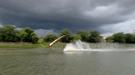 Longtail racing boat flips over on river in Thailand