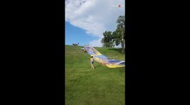 Woman gets involved in 'wristy' business following EPIC slip-n-slide misadventure