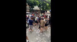 Dozens of people compete for food and money in a unique