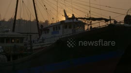 Multi lens shooting of sunrise in a fishing village.