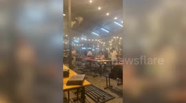 Storm batters BBQ restaurant drenching customers in dining area