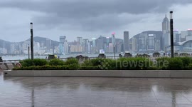 Eerie atmosphere on Avenue of Stars in Hong Kong where music plays and people take selfies during Super-Typhoon Saola