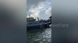 Ferry crashes into dock as Typhoon Saola batters the Philippines