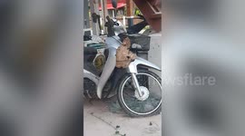 Parking sting! Hornets make a giant hive on the front of motorcycle