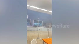 Storm whips through monorail station drenching passengers in Bangkok