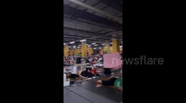 Workers seek shelter in underground garage from impending Typhoon