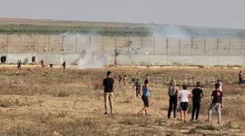 Palestinians demonstrate along the Israel-Gaza border, during a demonstration by the border fence with Israel, east of Gaza City