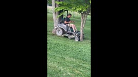 Lawnmowing Man Gets Stuck Between Trees