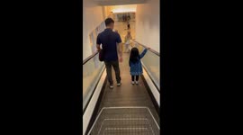 Chill escalator standoff: daughter refuses to be touched by her father