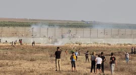 Palestinians demonstrate along the Israel-Gaza border, during a demonstration by the border fence with Israel, east of Gaza City