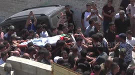 Mourners carry the body of Palestinian AbdulRahim Fayez Ghannam during his funeral in the village of Aqaba in the West Bank.