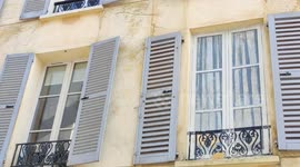 Fake windows on a building facade. Paris suburb, Versailles, France. 3 sept 2023.  This art is  called in french