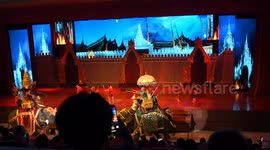 A dramatic show on stage featuring real elephants as they re-enact a battle scene from Thailand many years ago.