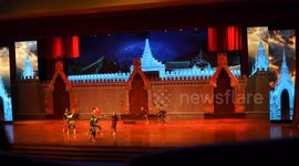 A dramatic show on stage featuring real elephants as they re-enact a battle scene from Thailand many years ago.